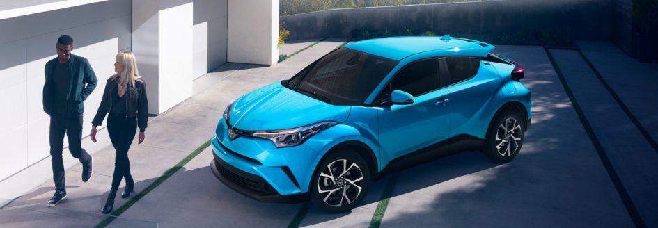 2 people walk away from their parked 2019 Toyota C-HR
