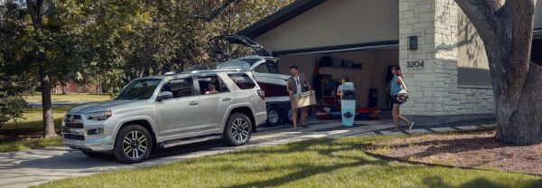 Silver 2019 Toyota 4Runner being loaded by a family going on vacation.